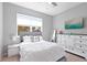 Bright bedroom with a comfortable bed, natural light, and elegant decor at 520 Valri Park Dr, Valrico, FL 33594