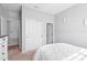 Neutral bedroom features carpet flooring, a double door closet and a bed with white bedding at 520 Valri Park Dr, Valrico, FL 33594