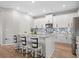 Bright kitchen showcasing white cabinets, stainless appliances, and a trendy backsplash at 520 Valri Park Dr, Valrico, FL 33594
