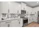 Close-up of the well-equipped kitchen featuring modern appliances, granite countertops, and ample storage at 520 Valri Park Dr, Valrico, FL 33594
