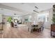 Open-concept living area with wood-look floors, neutral colors, and ample natural light at 520 Valri Park Dr, Valrico, FL 33594