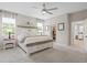 Comfortable main bedroom featuring a large bed, ensuite bathroom, and walk-in closet at 520 Valri Park Dr, Valrico, FL 33594