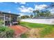 Spacious backyard featuring a brick patio, lush lawn, and privacy fence at 5215 Denver Ne St, St Petersburg, FL 33703