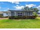 Charming backyard with a screen patio and well-maintained lawn at 5215 Denver Ne St, St Petersburg, FL 33703