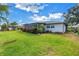 Lush backyard with mature landscaping and a partially screened patio at 5215 Denver Ne St, St Petersburg, FL 33703