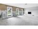 Bright living room with large windows, fireplace, and ample space for customization at 5215 Denver Ne St, St Petersburg, FL 33703