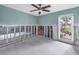 Living room featuring light blue walls, a ceiling fan and exposed studs, ready to be transformed at 5215 Denver Ne St, St Petersburg, FL 33703