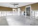 Open-concept living space under renovation with framing ready for customization, including a view into the bathroom at 5215 Denver Ne St, St Petersburg, FL 33703