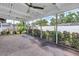 Relaxing outdoor patio with ceiling fans, string lights, and view of the backyard at 5215 Denver Ne St, St Petersburg, FL 33703