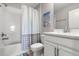 Well-lit bathroom featuring a tub with white tiling and a modern vanity with white cabinet at 5270 Neil Dr, St Petersburg, FL 33714