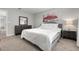 Cozy bedroom with neutral walls, carpet, a queen sized bed, and ample natural light at 5270 Neil Dr, St Petersburg, FL 33714