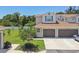 Charming townhome featuring a two-car garage, well-maintained lawn, and inviting curb appeal at 5270 Neil Dr, St Petersburg, FL 33714
