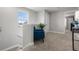 Bright landing area with neutral walls, plush carpeting, and a comfortable blue chair at 5270 Neil Dr, St Petersburg, FL 33714