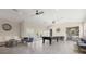 Open clubhouse space featuring a billiard table, comfortable seating and a stylish kitchenette at 5270 Neil Dr, St Petersburg, FL 33714