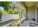 Tranquil screened-in patio overlooking a lush green yard with privacy fence, offering a serene retreat at 5270 Neil Dr, St Petersburg, FL 33714