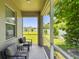 Relaxing screened-in patio with comfortable seating, offering a peaceful outdoor living space at 5270 Neil Dr, St Petersburg, FL 33714