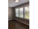 Bedroom with plantation shutters overlooking outdoor views at 5530 80Th N St # A306, St Petersburg, FL 33709
