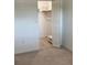 View into bedroom closet with louvered door and shelf at 5530 80Th N St # A306, St Petersburg, FL 33709