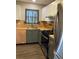 Updated kitchen with stainless steel appliances, a gas range, and stylish two-tone cabinetry at 5530 80Th N St # A306, St Petersburg, FL 33709