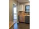 Bright kitchen featuring butcher block countertops, stainless steel sink, and modern grey and wood cabinets at 5530 80Th N St # A306, St Petersburg, FL 33709
