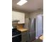 Kitchen with stainless steel appliances, gas range, butcher block countertops, and ample cabinet space at 5530 80Th N St # A306, St Petersburg, FL 33709