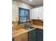 Kitchen sink and countertop area with butcher block countertops and updated fixtures at 5530 80Th N St # A306, St Petersburg, FL 33709