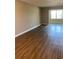 Bright living room featuring hardwood floors and large windows at 5530 80Th N St # A306, St Petersburg, FL 33709