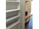 Pantry with plenty of storage shelves conveniently located near the kitchenette at 5530 80Th N St # A306, St Petersburg, FL 33709