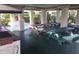 Covered outdoor picnic area with tables, seating and brick barbecue, surrounded by trees at 5530 80Th N St # A306, St Petersburg, FL 33709