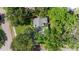 Aerial view of home with a well-maintained roof, surrounded by lush greenery and mature trees at 5901 3Rd S St, St Petersburg, FL 33705