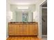 Bathroom boasts double sinks with granite countertops, ample storage and a tiled shower at 5901 3Rd S St, St Petersburg, FL 33705