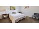 Cozy bedroom with natural light, neutral carpet, and simple furnishings at 5901 3Rd S St, St Petersburg, FL 33705