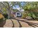 Charming single-story home with lush landscaping, mature trees and a brick facade at 5901 3Rd S St, St Petersburg, FL 33705
