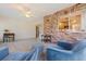 Enclosed Lanai with brick wall and open concept view into Kitchen at 5901 3Rd S St, St Petersburg, FL 33705