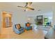 An inviting living space with hardwood floors, brick fireplace, and a seamless transition to the modern kitchen at 5901 3Rd S St, St Petersburg, FL 33705