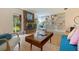 A well-lit living room featuring a brick fireplace, built-in shelving, and stylish furniture, enhancing its charm at 5901 3Rd S St, St Petersburg, FL 33705