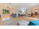 Open-concept living room featuring hardwood floors, abundant natural light, and modern furnishings, perfect for entertaining at 5901 3Rd S St, St Petersburg, FL 33705