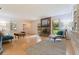 Bright and open living room with brick fireplace, built-ins, and hardwood floors offers inviting living space at 5901 3Rd S St, St Petersburg, FL 33705