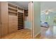 Spacious walk-in closet featuring custom shelving and drawers, connecting to the bedroom at 5901 3Rd S St, St Petersburg, FL 33705