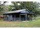Spacious barn with ample space for outdoor activities, storage, or animals at 6160 Fitzgerald Road, Odessa, FL 33556