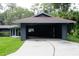 Spacious carport with ample parking and gray siding at 6160 Fitzgerald Road, Odessa, FL 33556
