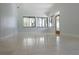 Bright living area boasting large windows and sleek tile floors for modern living at 6160 Fitzgerald Road, Odessa, FL 33556