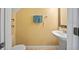 Half-bathroom with pedestal sink, neutral paint, and tile flooring at 6249 Osprey Lake Cir, Riverview, FL 33578