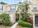 Inviting townhouse featuring well-maintained landscaping and a charming front entryway at 6249 Osprey Lake Cir, Riverview, FL 33578