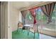 Cozy screened lanai with seating and a view of the backyard at 6249 Osprey Lake Cir, Riverview, FL 33578