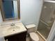 Bathroom featuring a marble vanity top, shower, and standard toilet at 647 Fairmont Ave # C, Safety Harbor, FL 34695