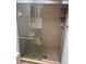 Bathroom featuring a sliding glass door enclosed shower and tile surround at 647 Fairmont Ave # C, Safety Harbor, FL 34695