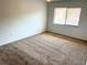 Cozy bedroom with neutral carpet, ample natural light from a window at 647 Fairmont Ave # C, Safety Harbor, FL 34695