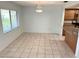 Tiled dining area featuring natural light and a seamless transition to the kitchen at 647 Fairmont Ave # C, Safety Harbor, FL 34695