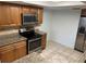 Updated kitchen with granite countertops, stainless steel appliances, and wood cabinetry at 647 Fairmont Ave # C, Safety Harbor, FL 34695